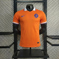 Classic orange Nike Netherlands home football jersey with a white collar displayed on a mannequin.